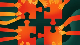 Multiple hands in various colors reach towards four interlocking puzzle pieces, symbolizing collaboration and teamwork. The puzzle pieces are orange and red, set against a dark green background.