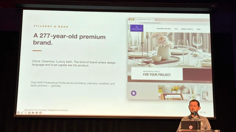 A speaker presents information about a 277-year-old premium brand, showcasing a website with design elements and project details.