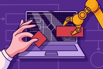 A robotic arm is positioned near a laptop screen displaying a grid and technical diagrams, while a human hand holds a red block, suggesting interaction between technology and manual input.